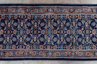 An Oriental hand-made runner, Kashmir, India. (D:810 x W:73 cm)