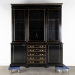 A black lacquered bookcase with gilt hardware. 20th C. (D:42 x W:167 x H:198 cm)