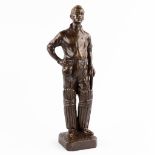 Figurine of a cricket player, patinated bronze. Signed. J.A. Reg. (H:43 cm)