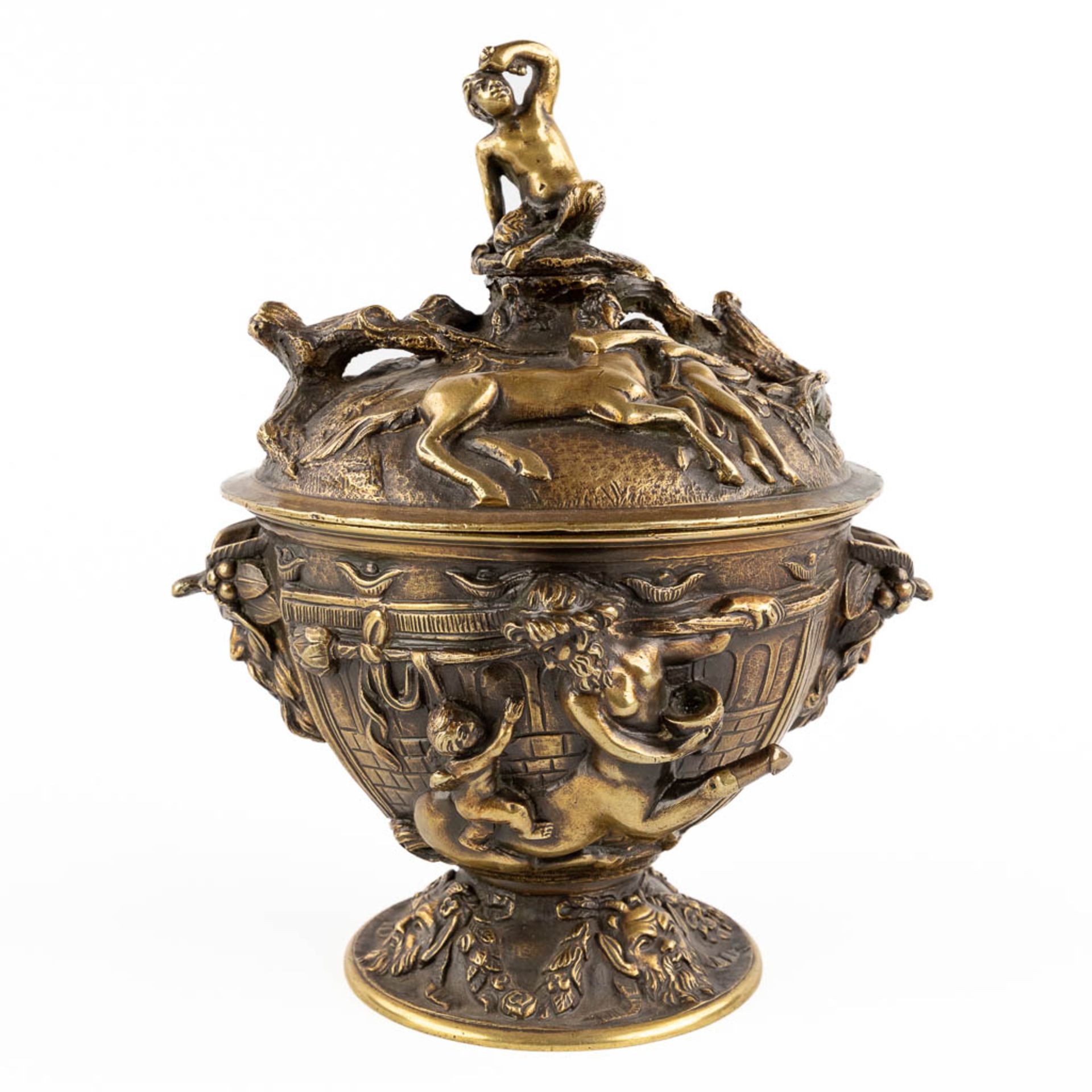 A pot with a lid, decorated with mythological figurines, patinated bronze. (H:23 x D:16 cm)