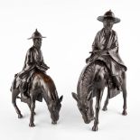 Two Oriental wise men on horses, patinated bronze. (D:17 x W:42 x H:45 cm)
