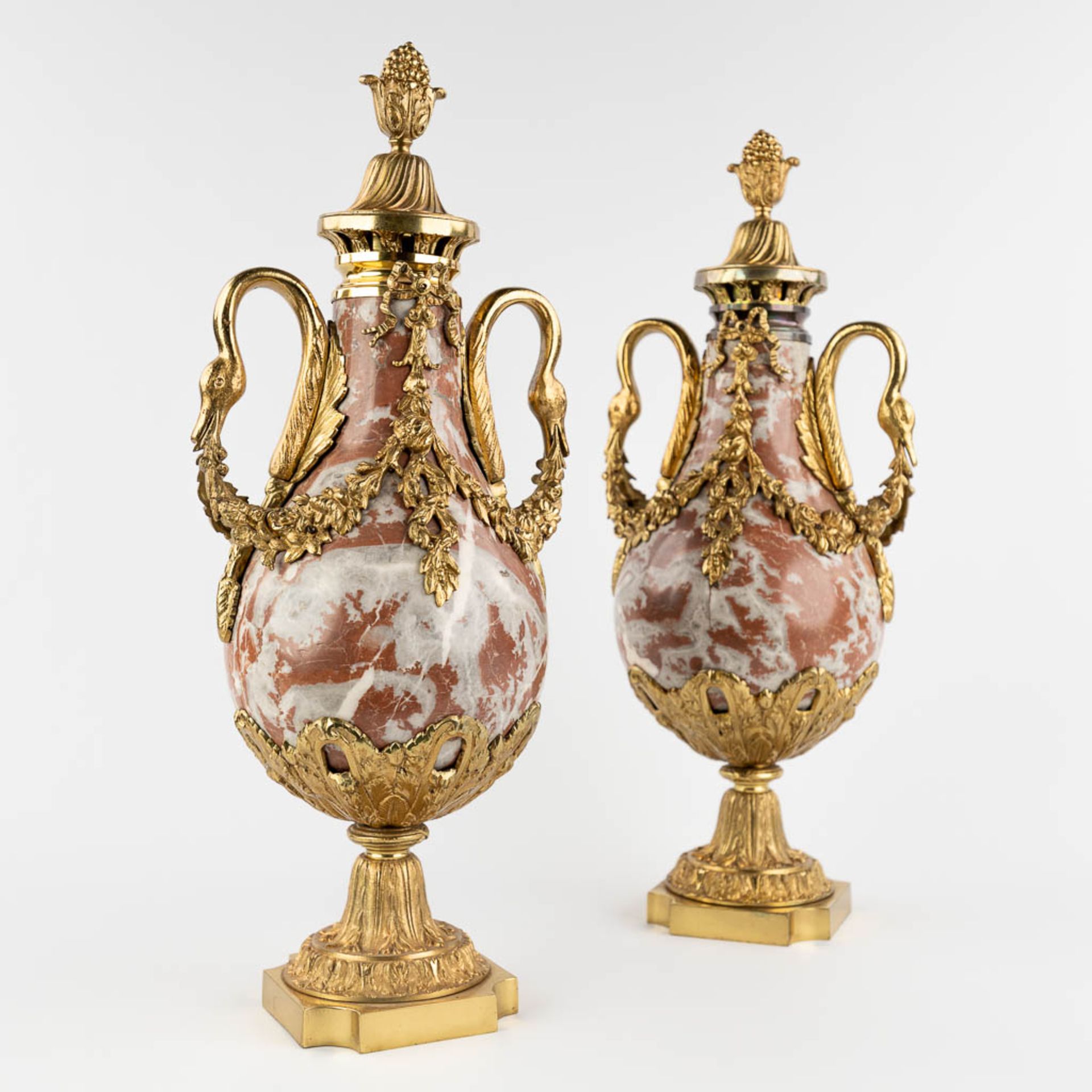 A pair of cassolettes, red and grey marble mounted with bronze in Empire style. (D:18 x W:23 x H:54 