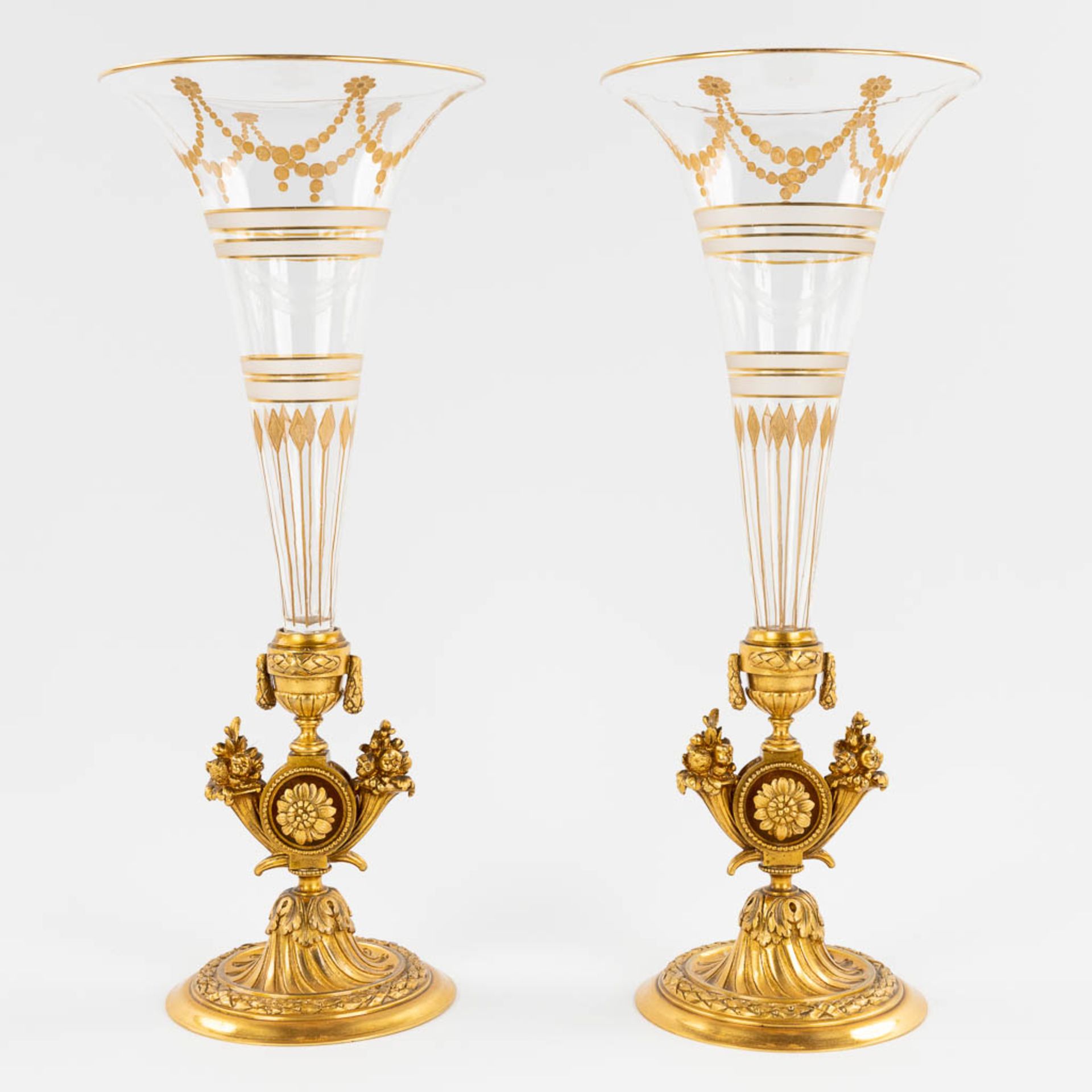 A pair of trumpet vases, gilt bronze and glass in Louis XVI style. 19th C. (H:31,5 x D:13 cm)