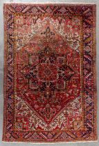 An Oriental hand-made carpet, Heriz. (D:338 x W:227 cm)