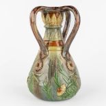 Léo MAES-VEREENOOGHE (XIX-XX) A vase, Flemish Earthenware with a flower decor. (H:33 x D:22 cm)