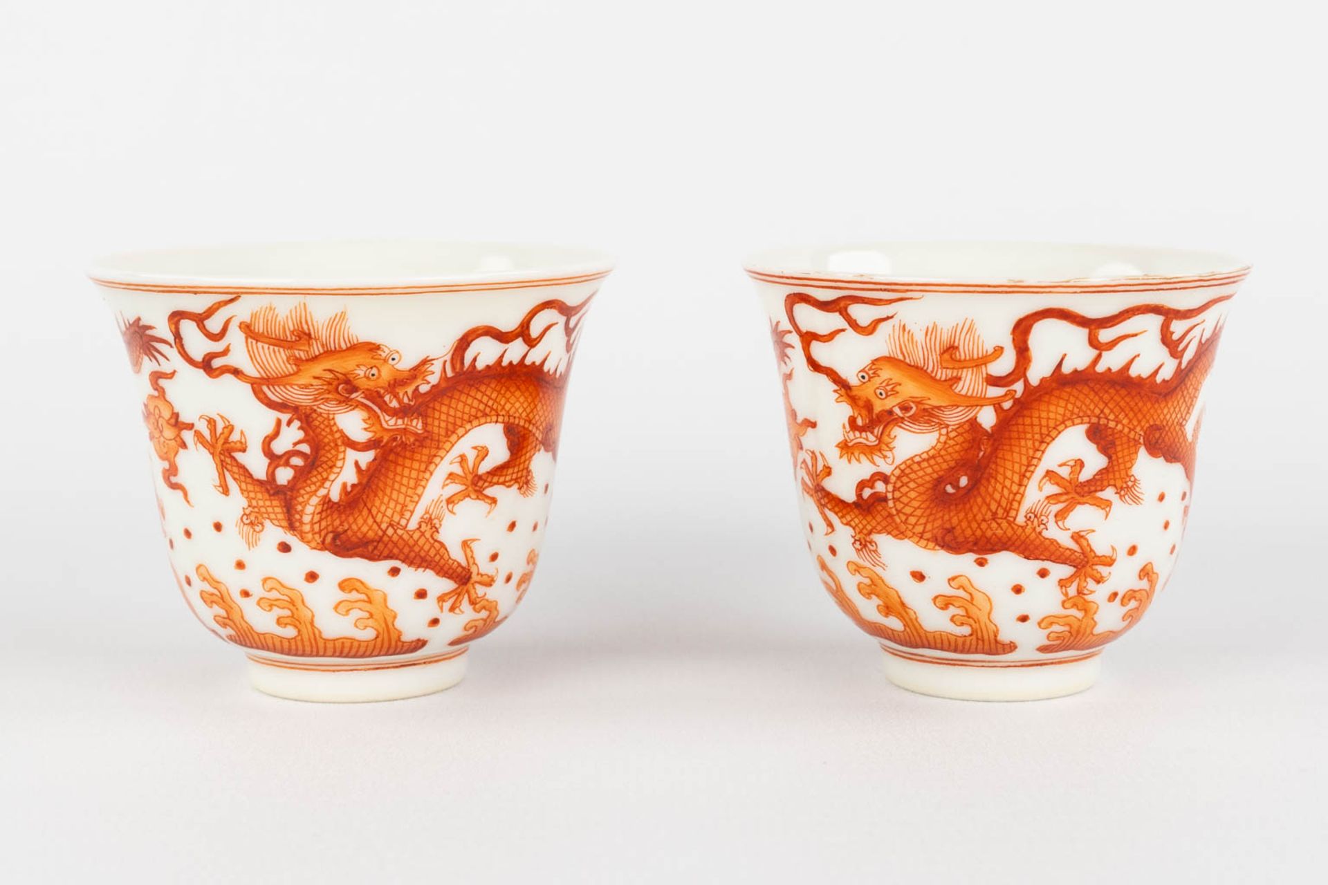 A pair of Chinese teacups, red dragon decor, Guangxu mark and period. (D:6 x H:5 cm)