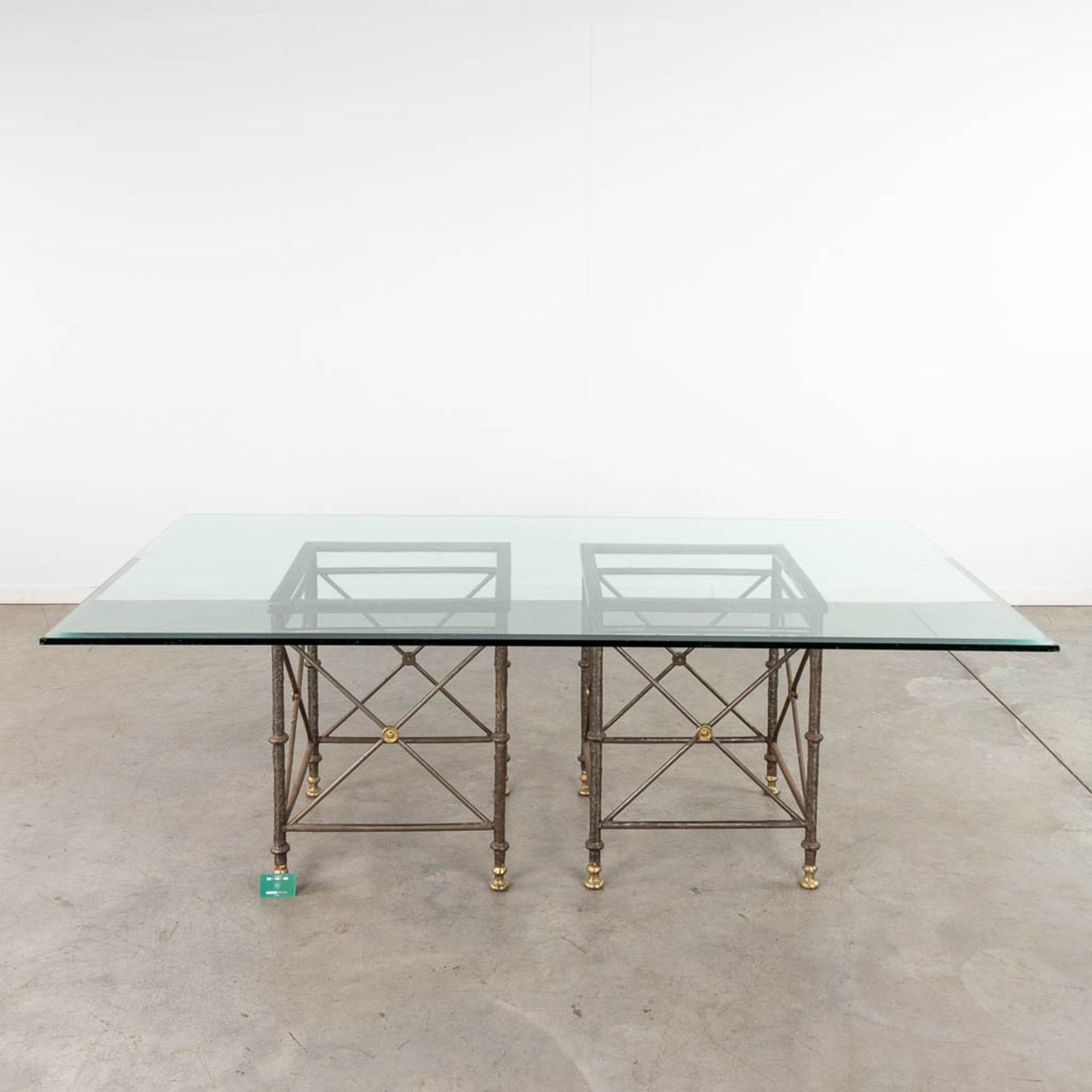 A table with large glass top and a wrought-iron and brass base. (D:120 x W:220 x H:74 cm) - Image 2 of 10