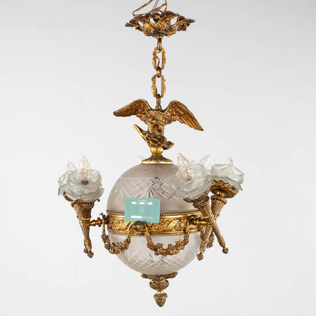 A chandelier, bronze mounted with glass and flambeaux and an eagle in Louis XVI style. (H:60 x D:44  - Bild 2 aus 12