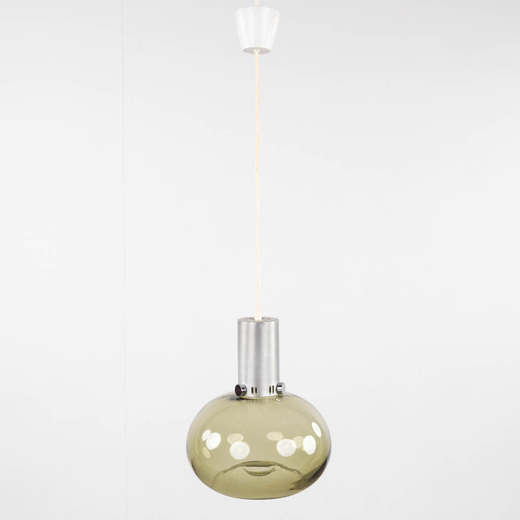 Raak, Amsterdam, a ceiling lamp with tinted glass shade, chromed metal. Circa 1960. (H:60 x D:29 cm)