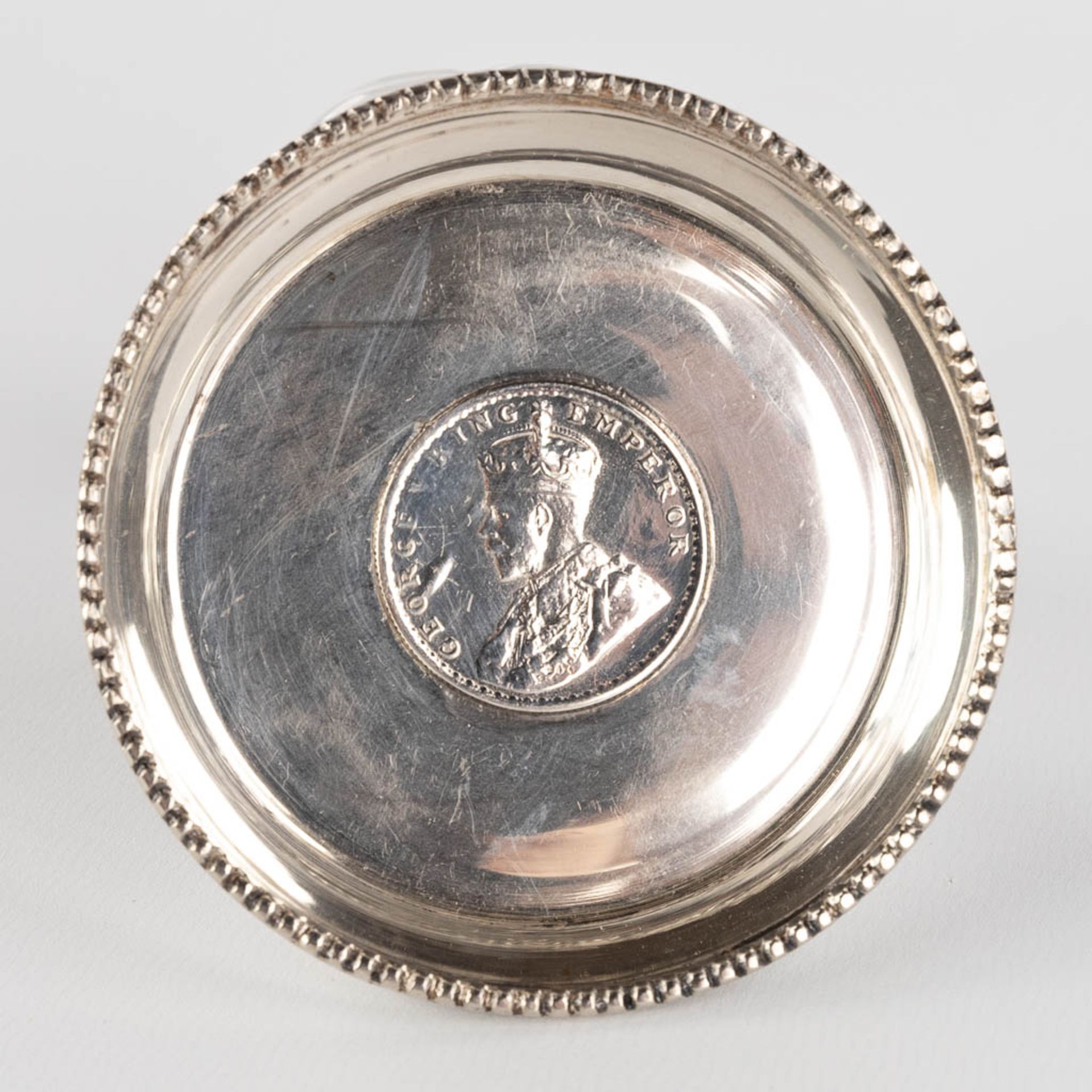 A silver-plated serving tray, two candlesticks and a bowl with Silver coin, One Rupee 1918. (D:37 x - Image 7 of 18