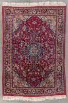 An Oriental hand-made carpet. Persia. (D:148 x W:107 cm)