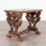 A coffee table, sculptured wood with mythological figurines and parquetry. Italy. Circa 1900. (D:50