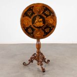 A tilt-top side table, marquetry inlay with images of the hunt, Black Forest, Circa 1900. (H:73 x D: