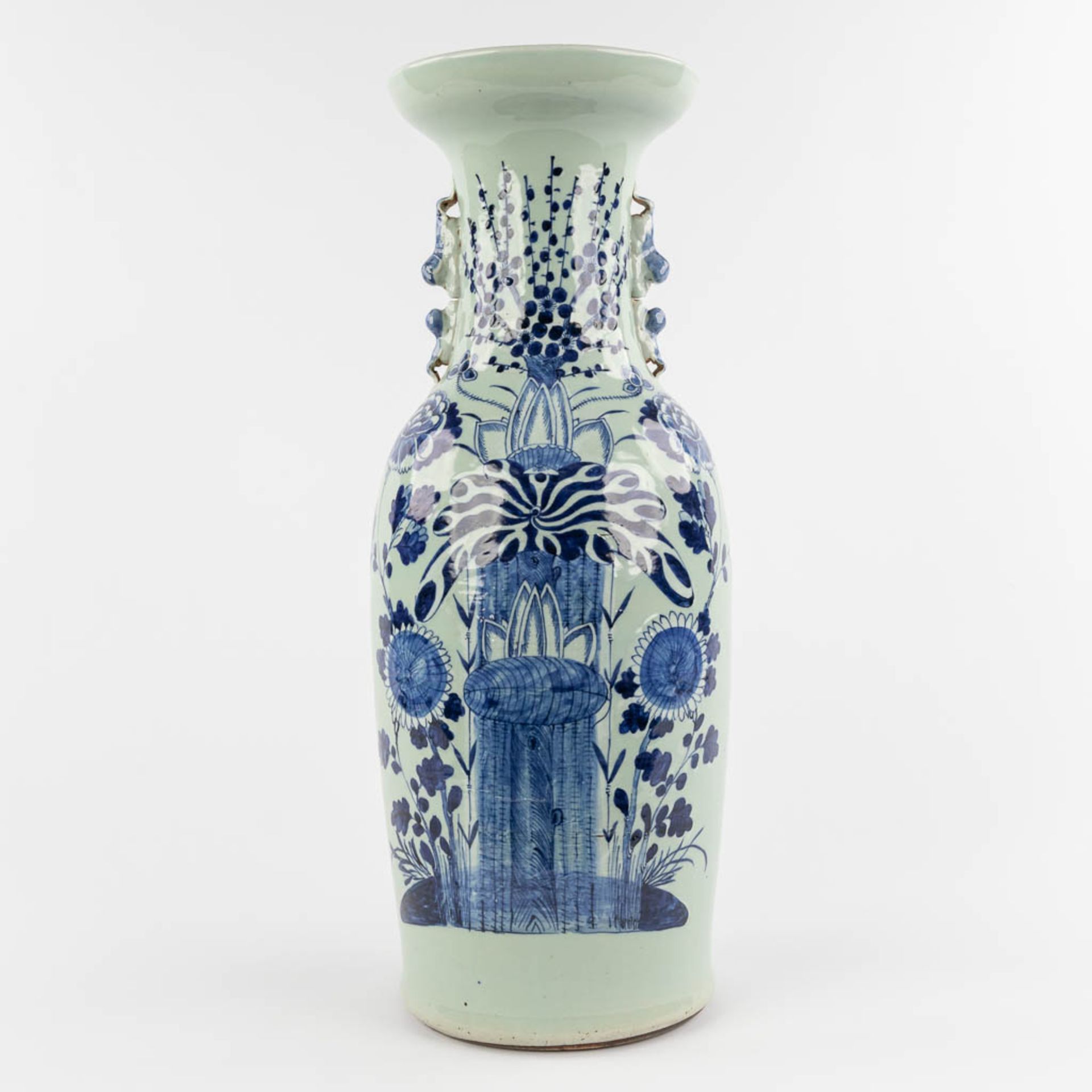 A Chinese Celadon vase with floral decor. 19th/20th C. (H:59 x D:21 cm)