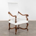 A wood-sculptured armchair in Louis XV style. (D:62 x W:68 x H:116 cm)