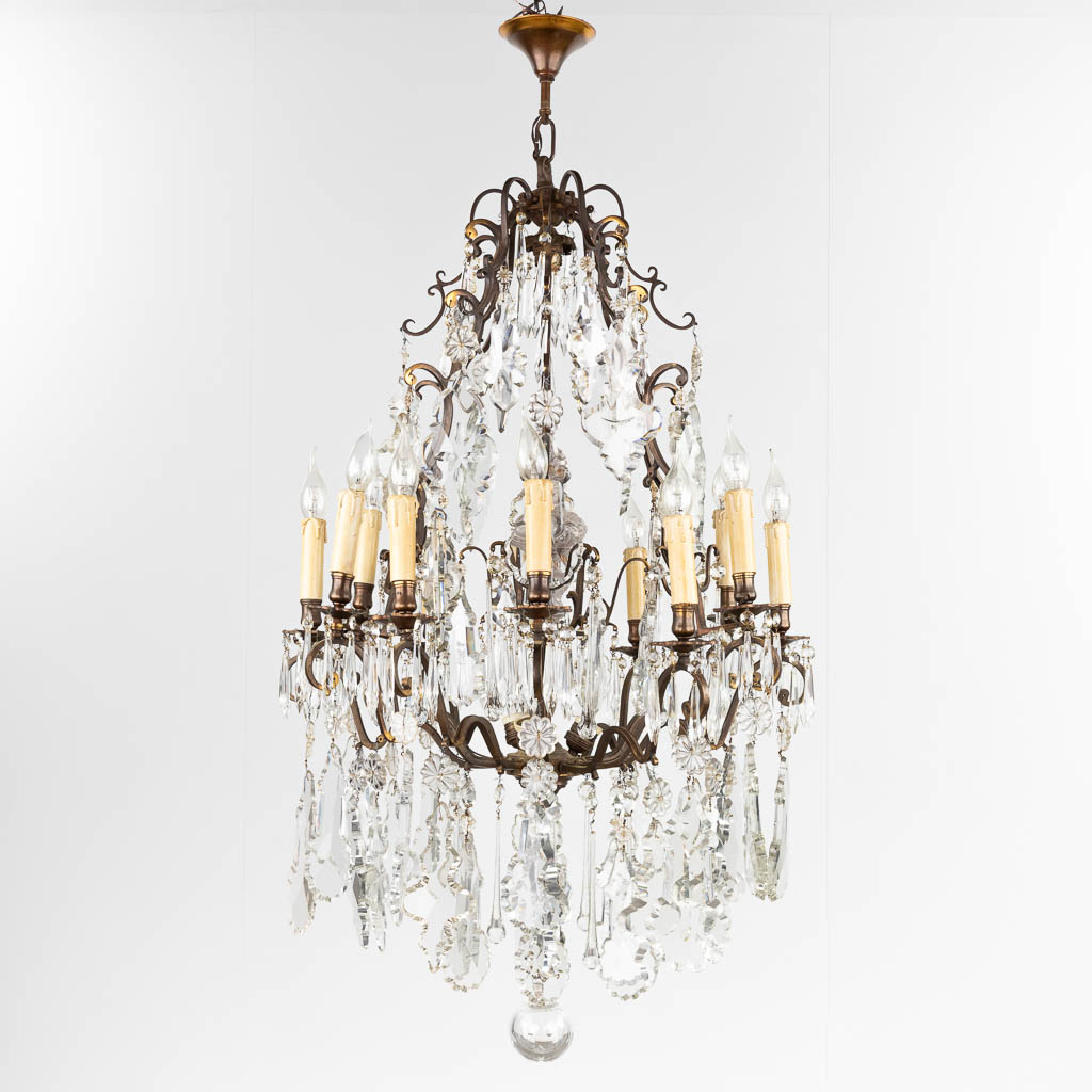 A big antique chandelier, brass and glass. France. Circa 1900. (H:122 x D:66 cm)