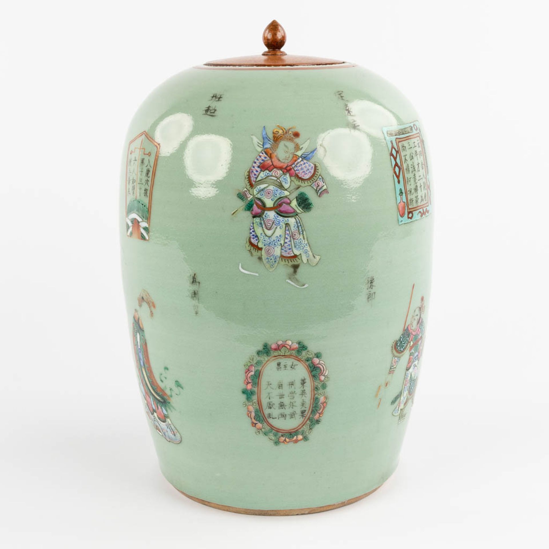 A Chinese Celadon ground ginger jar, decorated with warriors, calligraphy, and mythological figurine