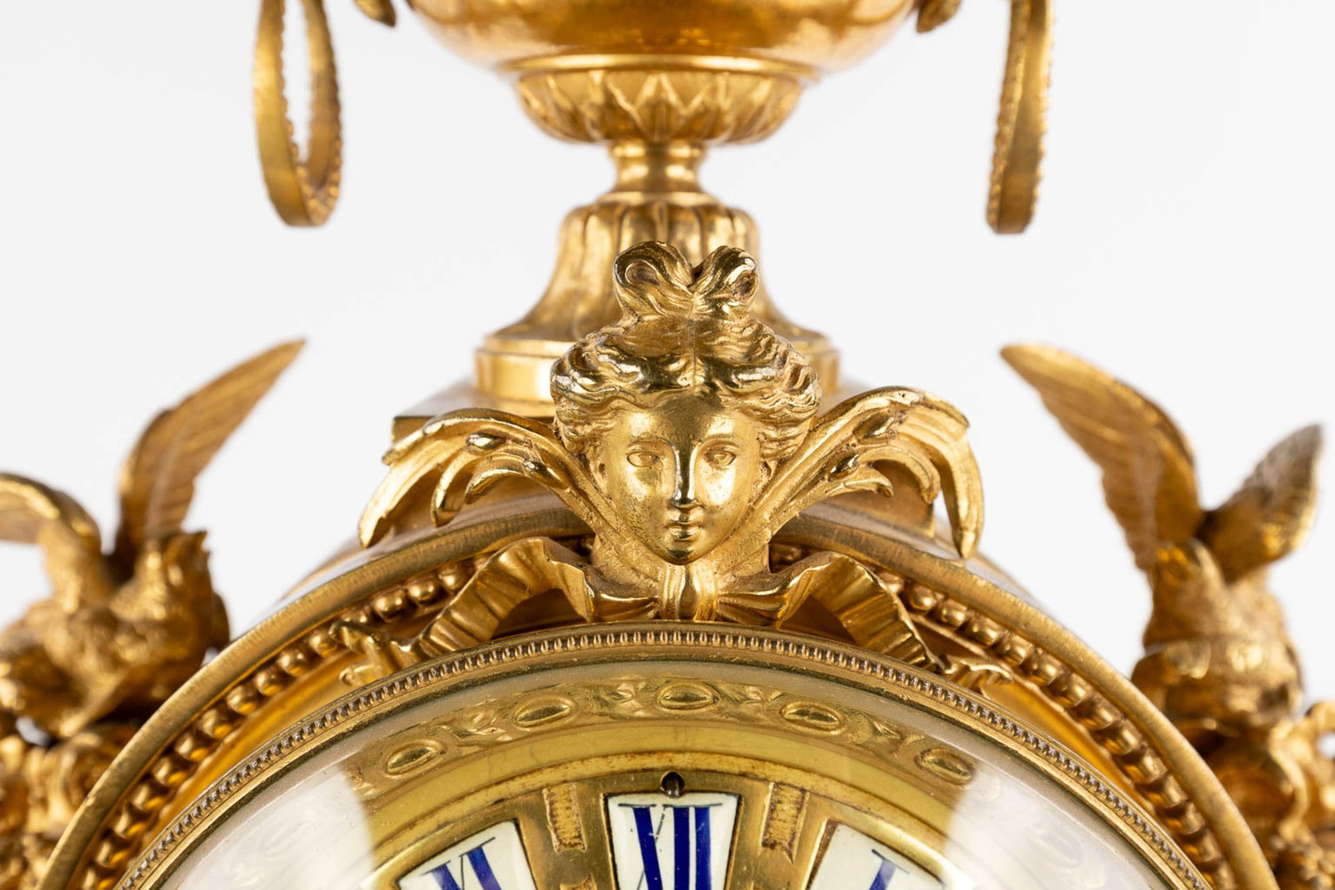 A three-piece mantle garniture clock and candelabra, gilt bronze in a Louis XVI style, 19th C. (D:19 - Image 14 of 19