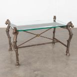 A coffee table, cast-iron and glass, decorated with horse heads. 20th C. (D:65 x W:98 x H:59 cm)