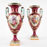 A pair of polychrome porcelain vases with a flower decor, probably Porcelaine De Paris. (D:15 x W:22