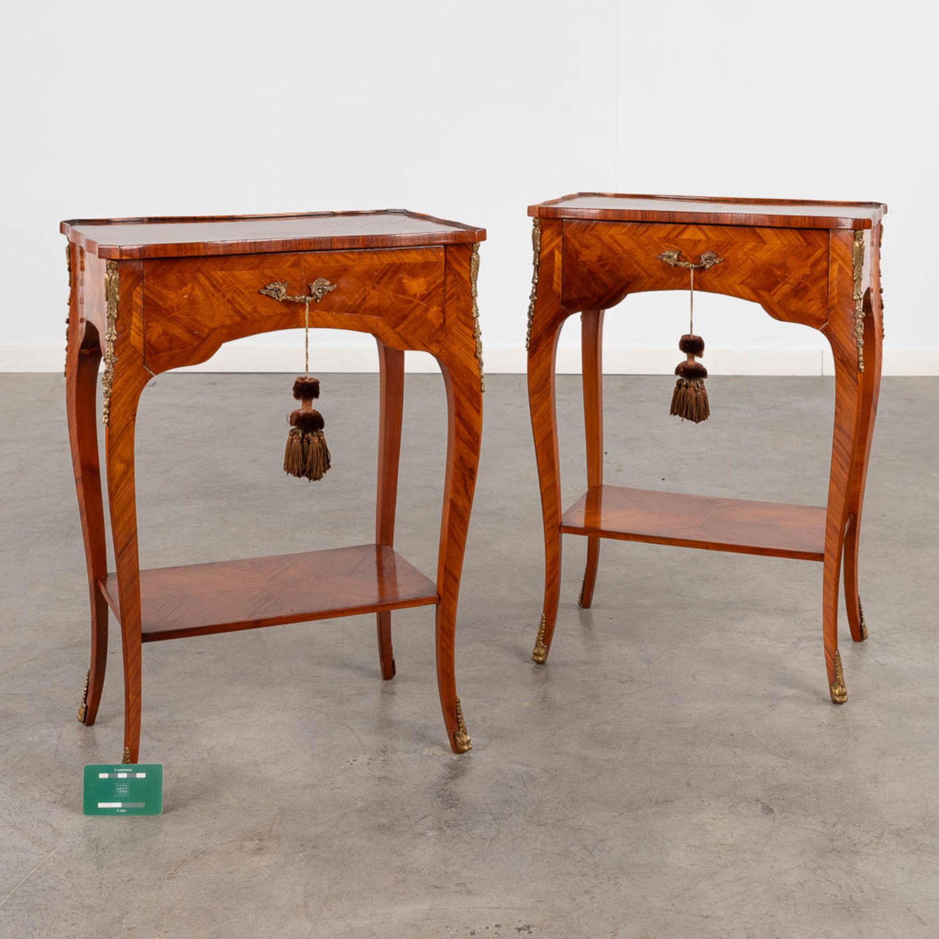 A pair of two-tier side tables with a drawer, wood with marquetry inlay. 20th C. (D:30 x W:45 x H:63 - Image 2 of 14
