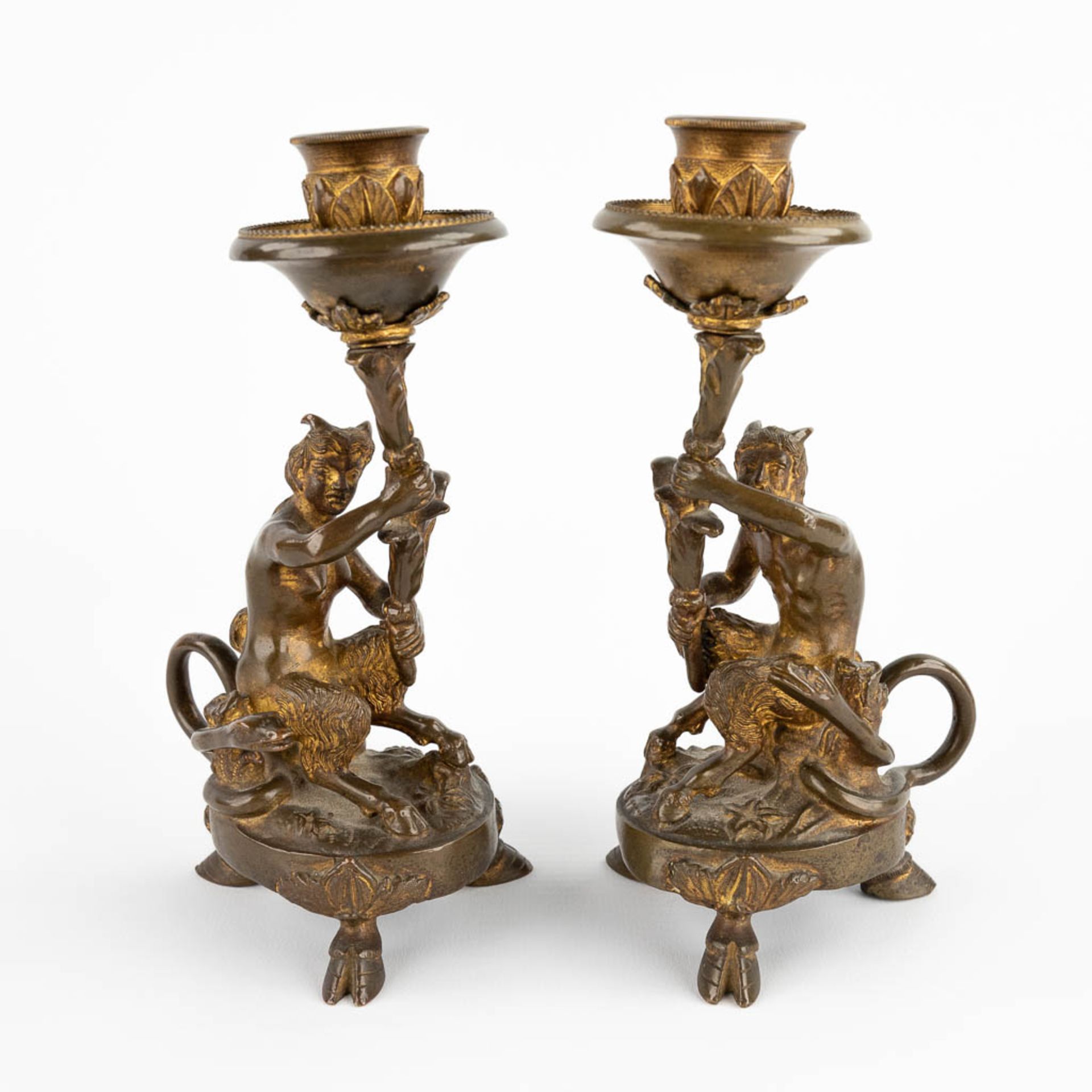 A pair of candlesticks with Satyr figurines, gilt bronze. 19th C. (D:7 x W:10 x H:17,5 cm)