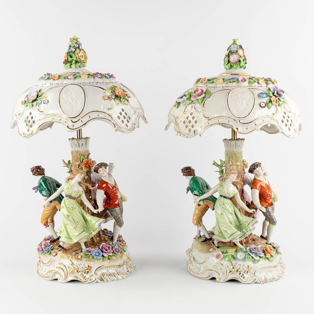Two identical table lamps, polychrome porcelain with dancing figurines. Germany. 20th C. (D:32 x H:5