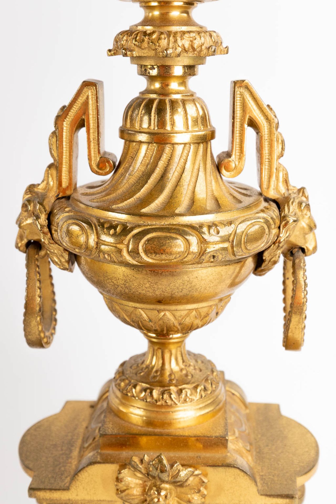 A three-piece mantle garniture clock and candelabra, gilt bronze in a Louis XVI style, 19th C. (D:19 - Image 10 of 19
