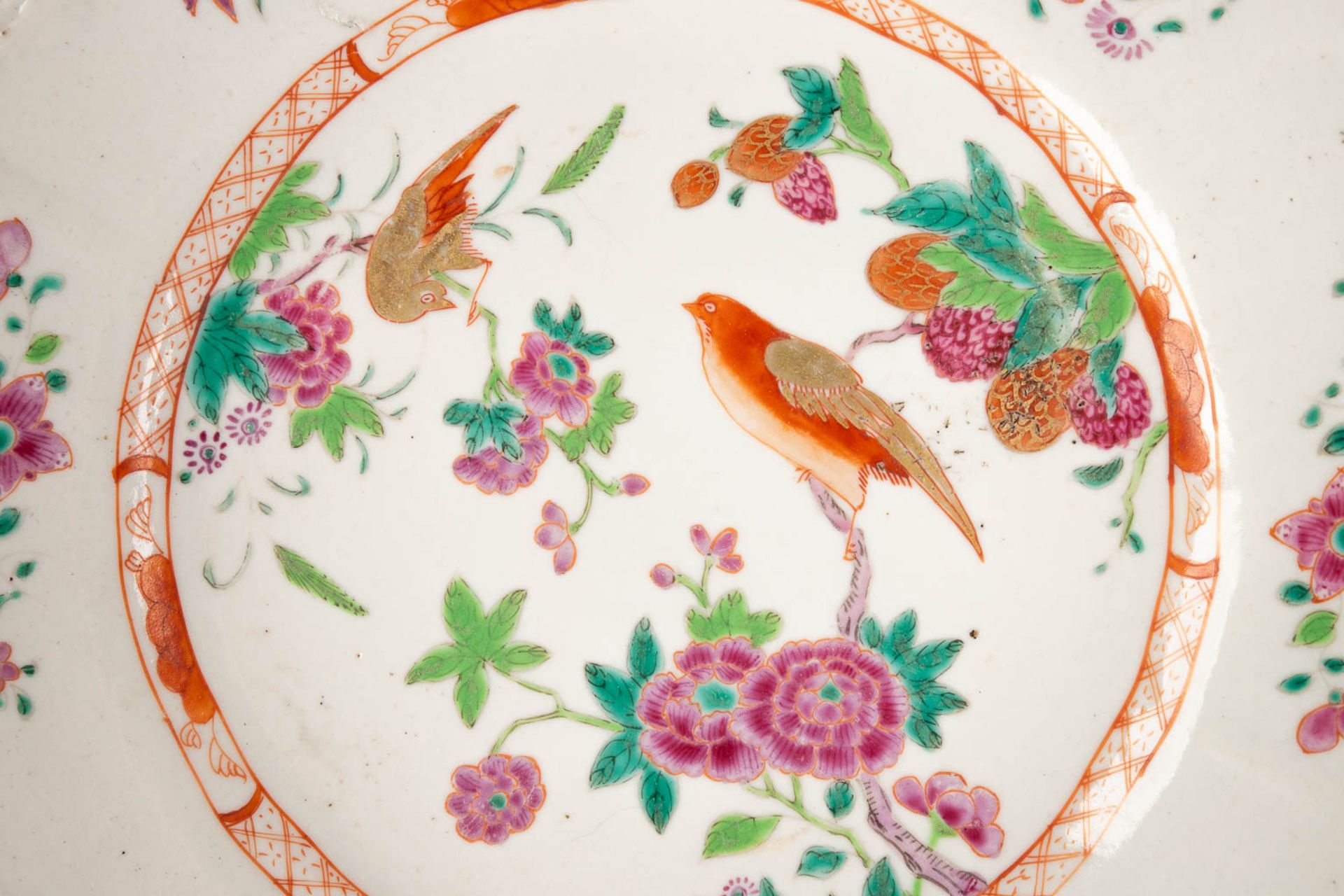 Three Chinese Famille Rose plates, decorated with fauna and flora. 19th/20th C. (D:23,5 cm) - Image 5 of 9