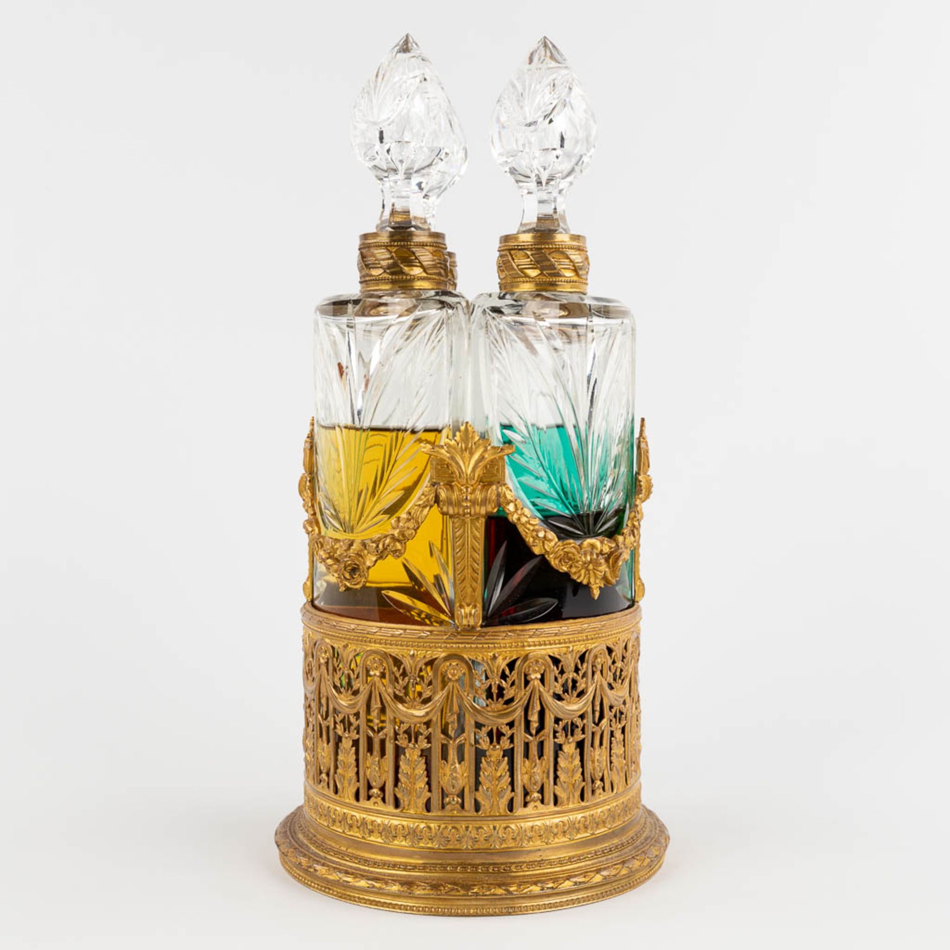 A Perfume set, gilt bronze in Louis XVI style with 4 glass bottles, Napoleon 3 period. (H:31 x D:15 