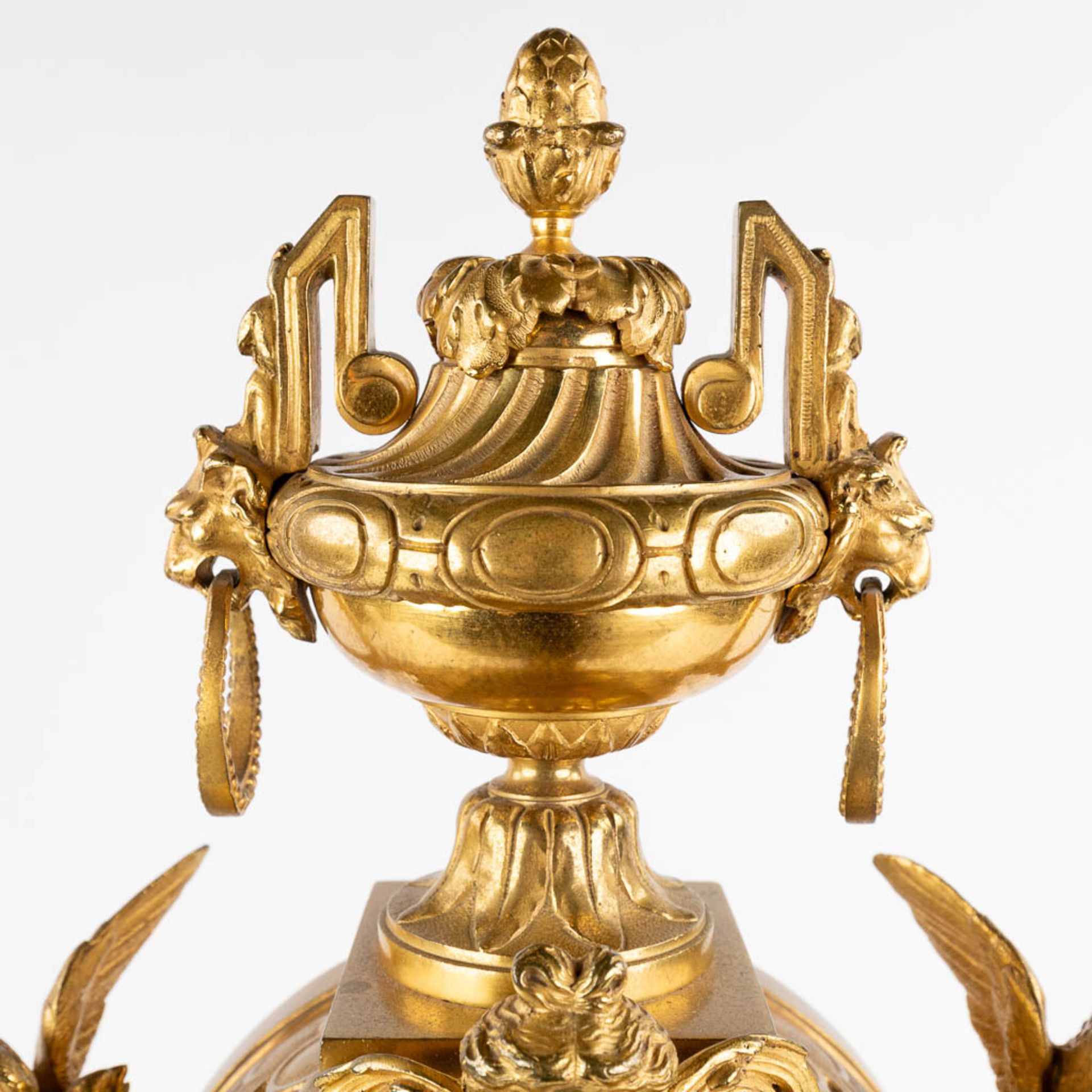 A three-piece mantle garniture clock and candelabra, gilt bronze in a Louis XVI style, 19th C. (D:19 - Image 13 of 19