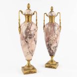 A pair of marble cassolettes mounted with bronze, Empire style. 19th C. (D:11 x W:13 x H:43 cm)