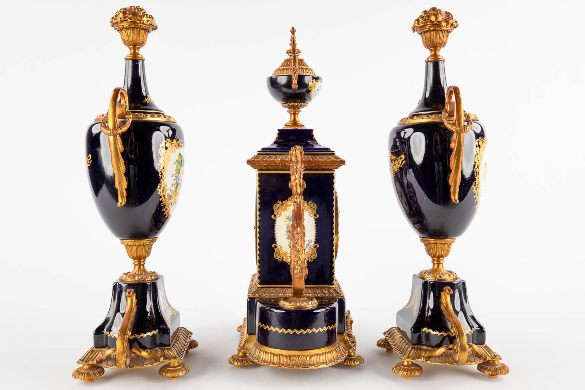 A.C.F. A three-piece mantle garniture clock and side pieces, cobalt blue porcelain mounted with bron - Image 4 of 14