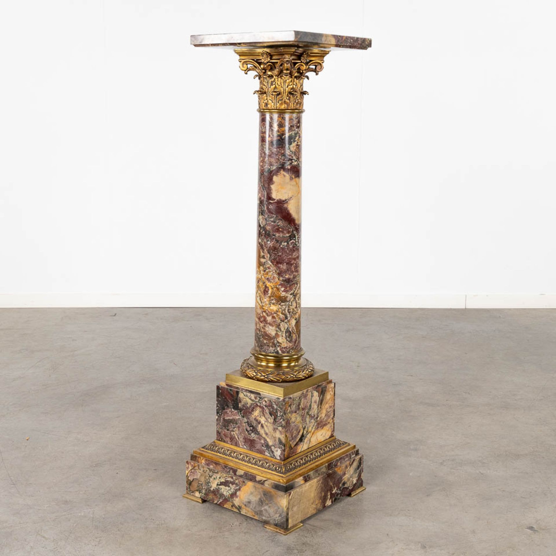 A pedestal, marble mounted with bronze in Corinthian style. Circa 1920. (D:35 x W:35 x H:120 cm)