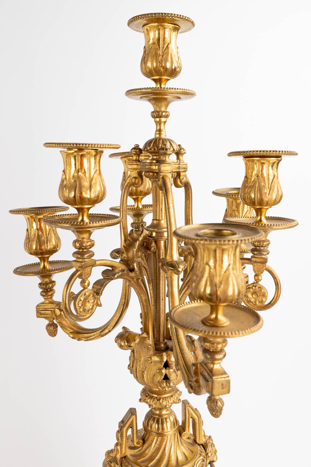 A three-piece mantle garniture clock and candelabra, gilt bronze in a Louis XVI style, 19th C. (D:19 - Image 9 of 19