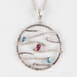 A large pendant, 18kt white gold with brilliants, appr. 1,64ct, Topaz and Amethist, 10,84g.