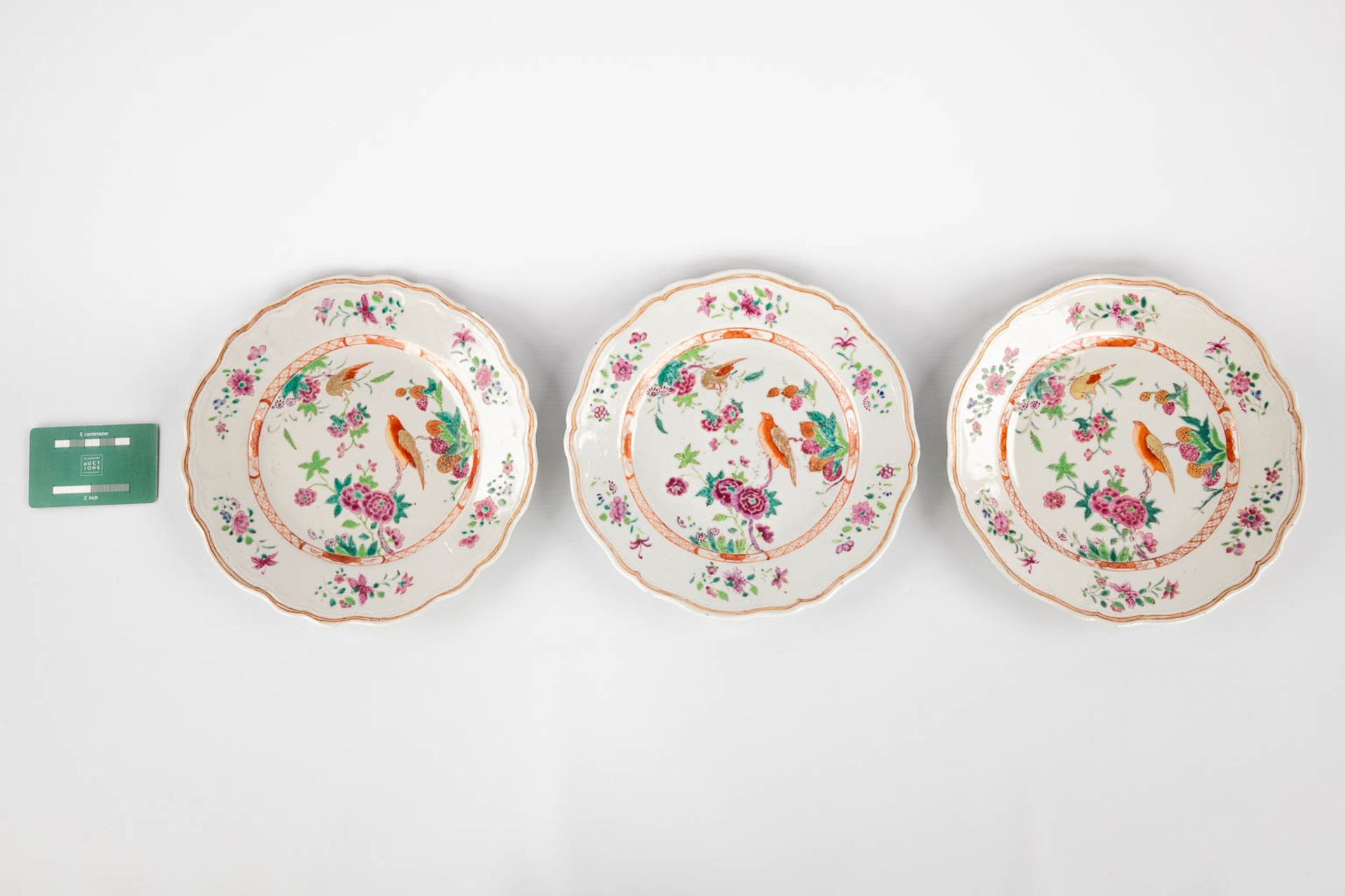 Three Chinese Famille Rose plates, decorated with fauna and flora. 19th/20th C. (D:23,5 cm) - Image 2 of 9