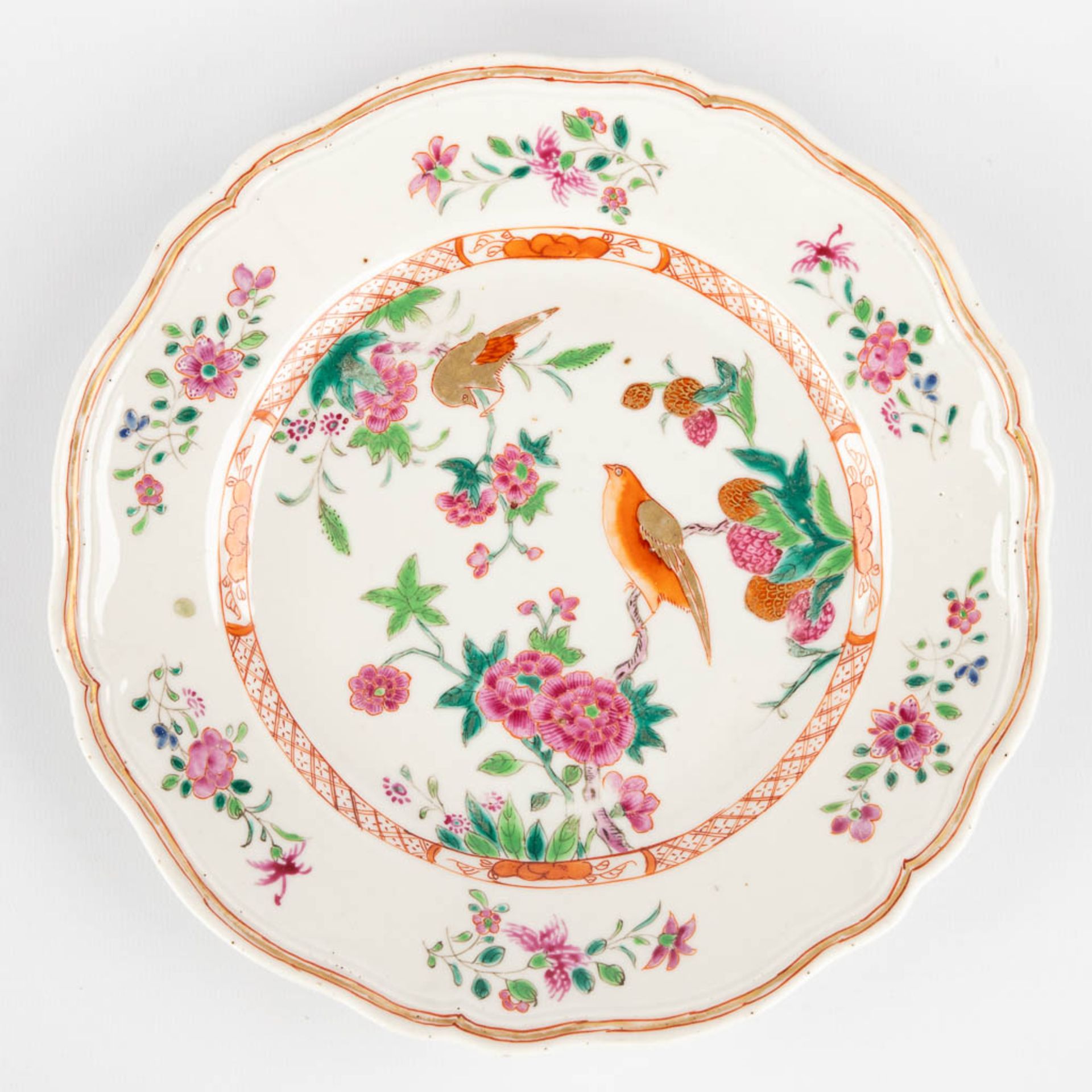 Three Chinese Famille Rose plates, decorated with fauna and flora. 19th/20th C. (D:23,5 cm) - Image 8 of 9