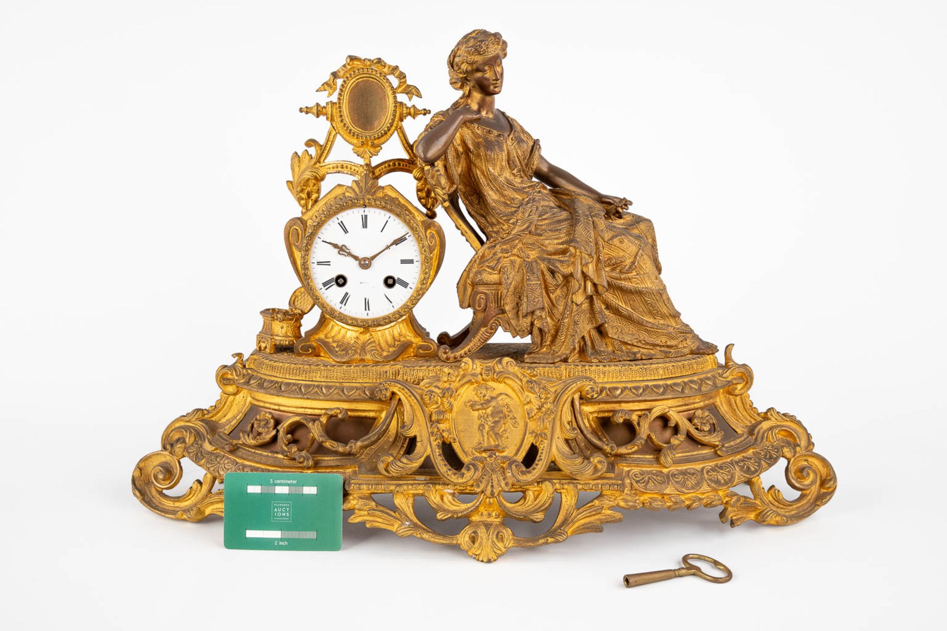 A mantle garniture clock, gilt bronze decorated with a Lady in a sofa. Late 19th C. (D:18 x W:56 x H - Image 2 of 14