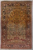 An Oriental hand-made carpet, decorated with a tree. (D:202 x W:132 cm)