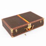 Louis Vuitton, A vintage travellers suitcase, leather and faux leather. (D:53 x W:76 x H:18 cm)