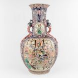 A large and decorative Chinese vase with a dragon decor, fauna and flora. 20th C. (H:73 x D:41 cm)