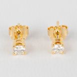 A pair of earrings, 18kt yellow gold with solitary diamonds, appr.,66ct, G-SI2, 2,21g.