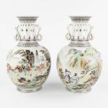 A pair of Chinese vases, decorated with figurines and landscapes. 20th C. (H:30 x D:18 cm)