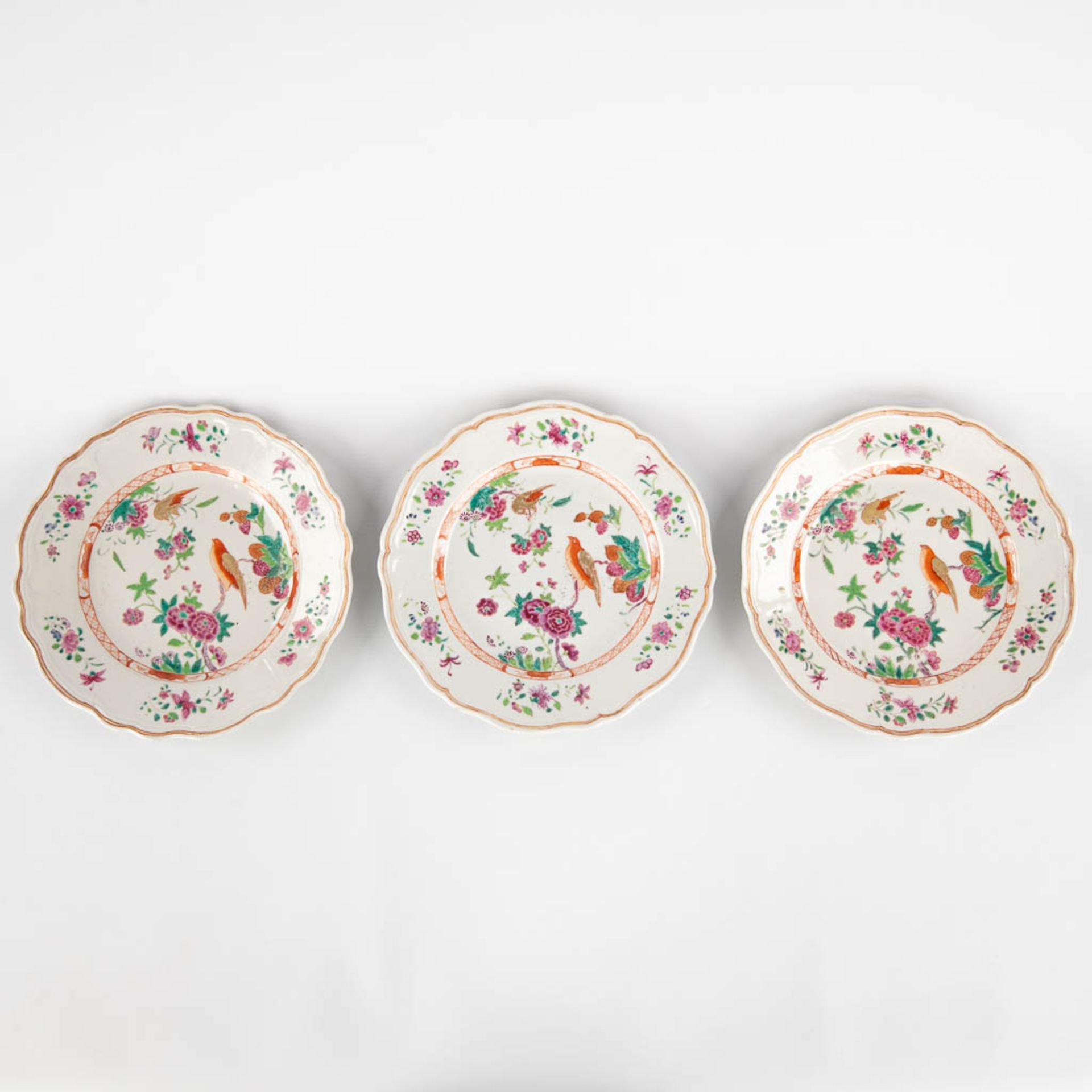 Three Chinese Famille Rose plates, decorated with fauna and flora. 19th/20th C. (D:23,5 cm)