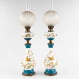 A pair of antique opaline table lamps, decorated with fauna and flora, etched glass shades. (H:77 x