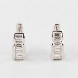 A pair of earrings, 18kt white gold with baguette-cut diamonds, appr.,56ct. 3,30g.
