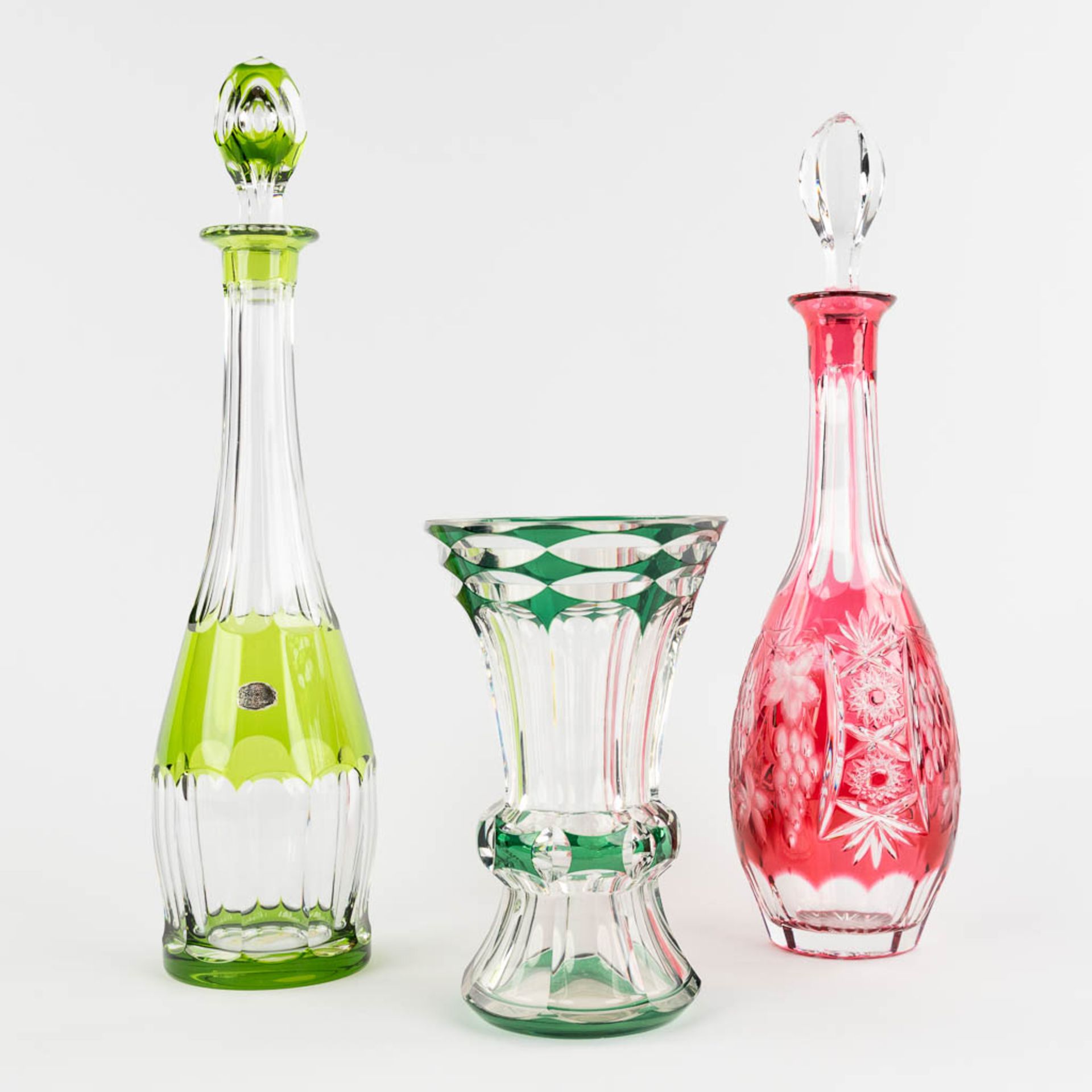 Val Saint Lambert, a carafe and a vase, added a Bohemian Carafe. (H:41 cm)