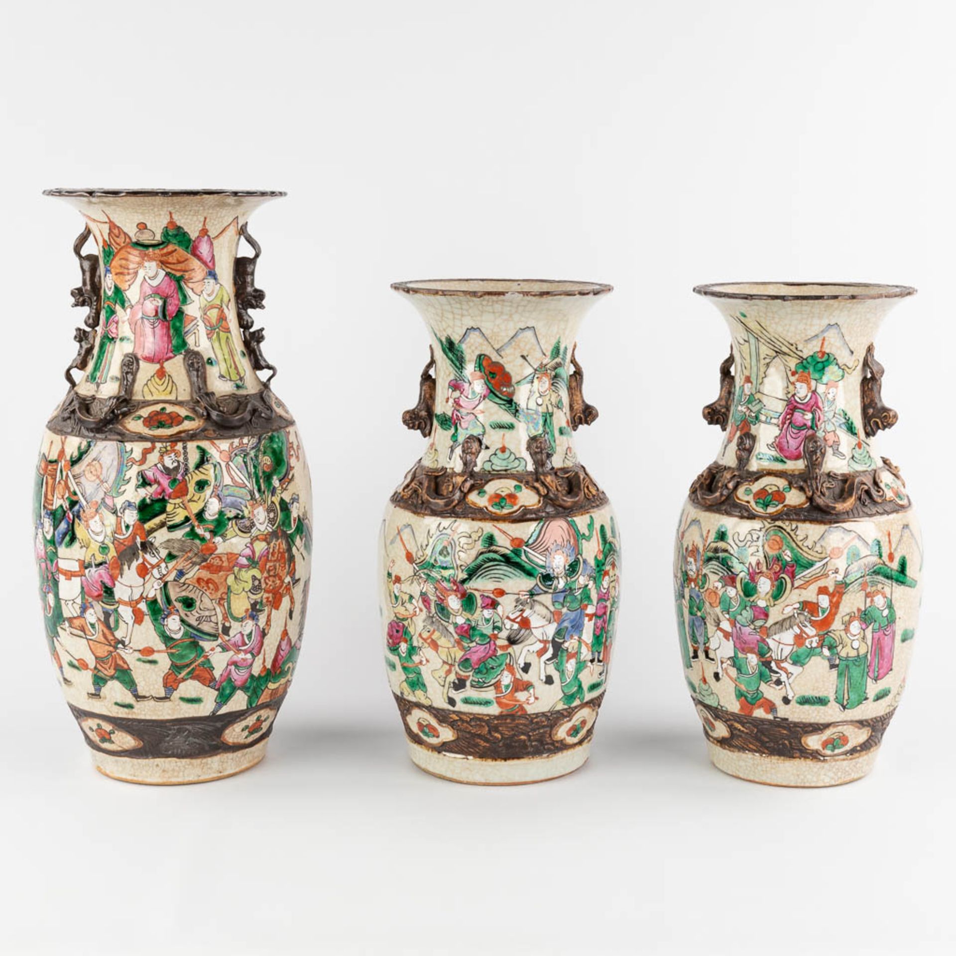 Three Chinese vases decorated with warriors, Nanking. 20th C. (H:43 x D:20 cm)