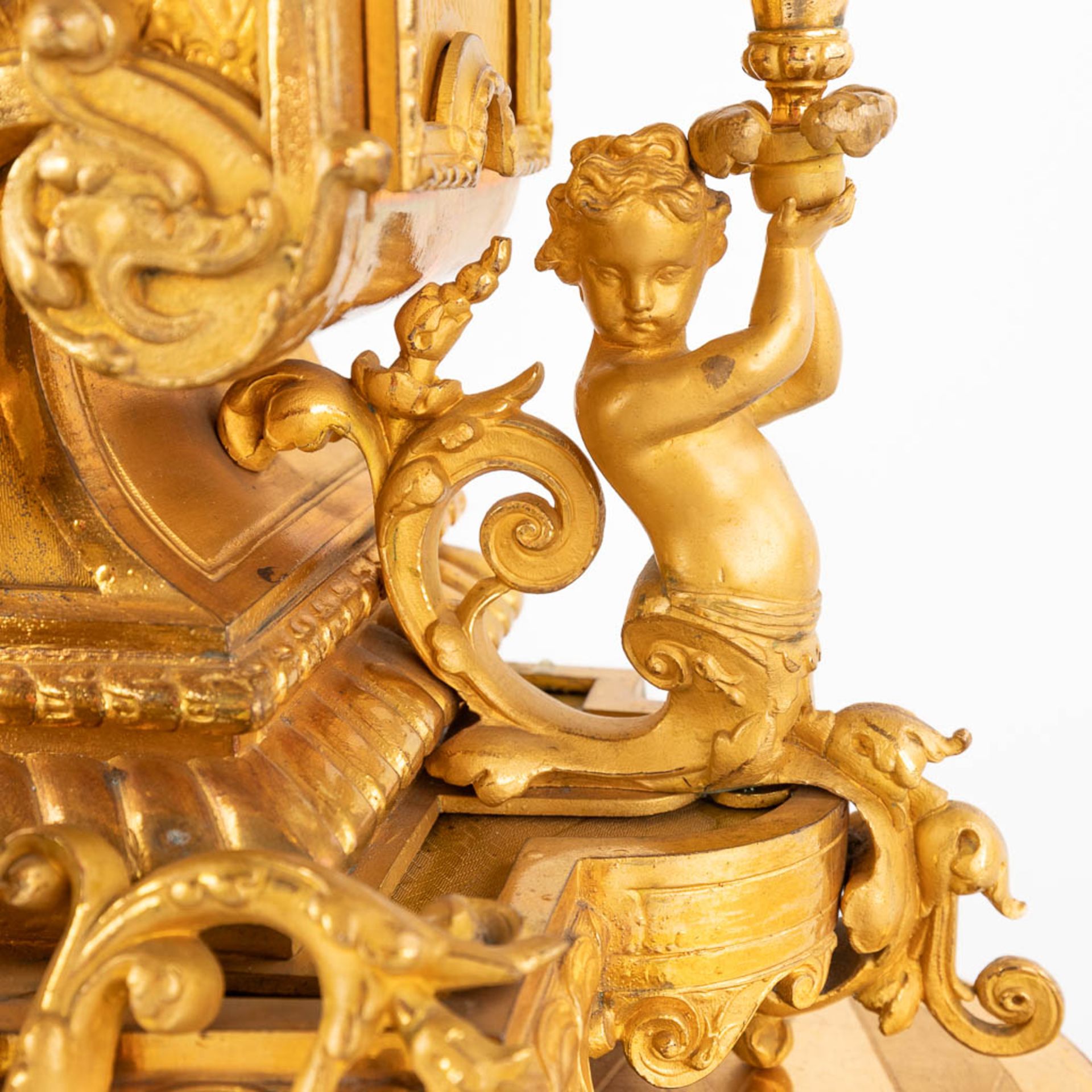 A three-piece mantle garniture clock and candelabra, gilt spelter, decorated with putti. Circa 1900. - Image 17 of 19